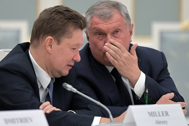 Глава "Газпрома" Алексей Миллер (слева) и глава "Роснефти" Игорь Сечин (справа)