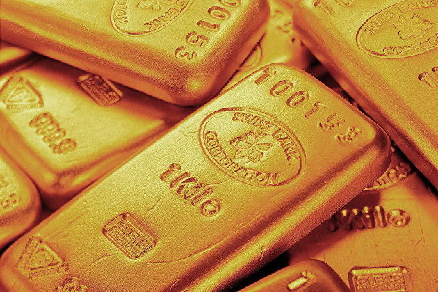Стоимость золота несколько опускается за счет удорожания доллара к мировым валютам