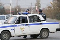 Сотрудники Дорожно-патрульной службы на месте происшествия в Каспийске