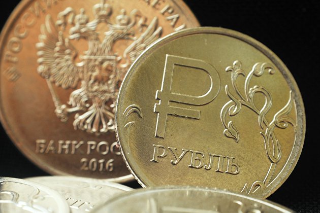 Монета номиналом один рубль с символикой Российского рубля