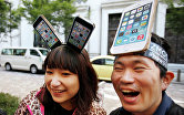 Поклонники Apple в Токио ждут своей очереди, чтобы приобрести новые iPhone