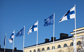 Флаги Финляндии и НАТО около здания МИД Финляндии