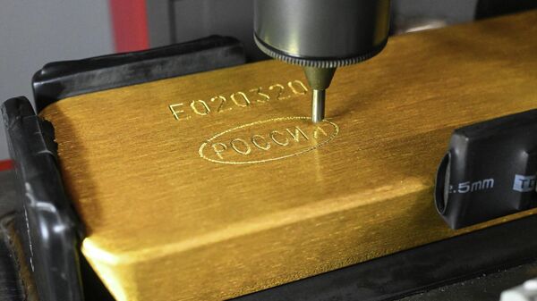 Маркировка золотого слитка высшей пробы