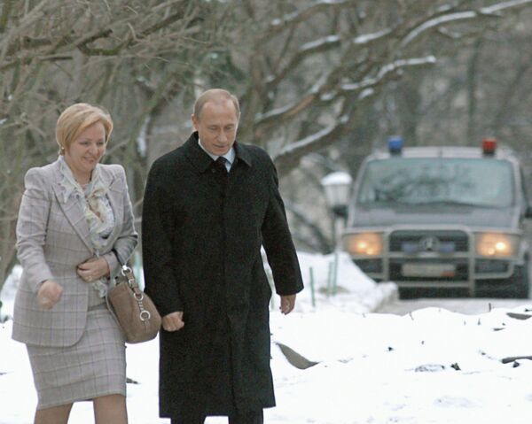 Владимир Путин и Людмила Путина в день выборов